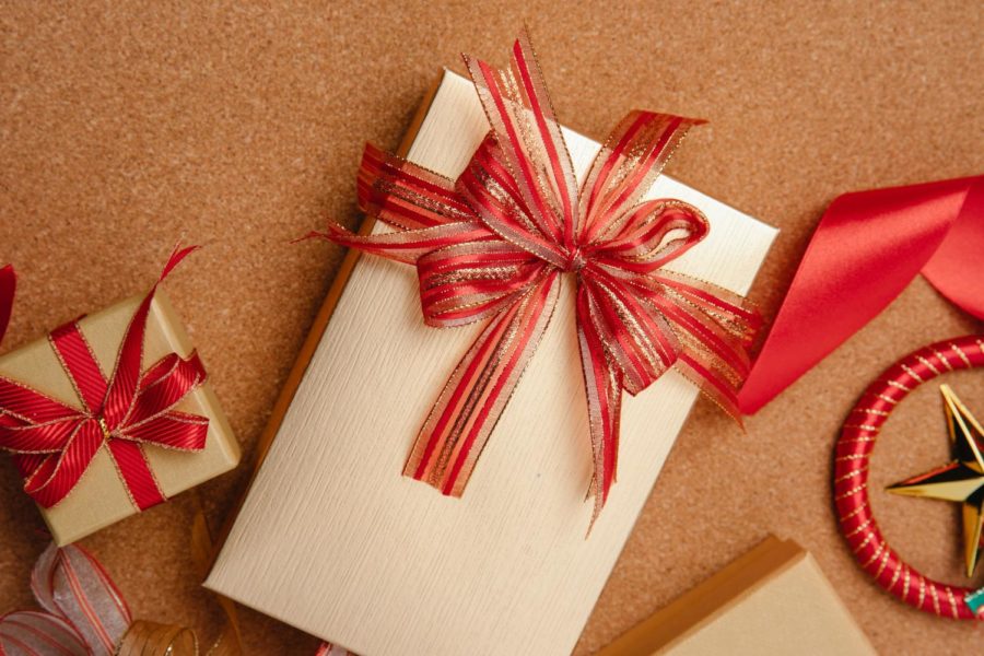 Christmas gifts wrapped in red ribbon