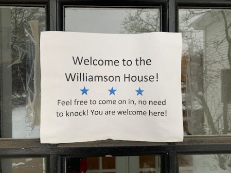 A typed sign on the door of the Williamson House reads "Welcome to the Williamson House! Fell free to come on in, no need to knock! You are welcome here!"