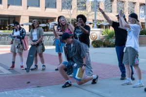 Performative Masc Lesbian Contest cheer on fellow contestant, freshman aeronautical studies major Cora Russell, during the contest on Saturday, Sept. 27, 2025.