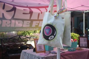 Kent Pride Fest tote bags hang in Kent Pride's booth at Rainbow Weekend, Oct. 18, 2025.
